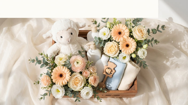 Editorial baby hamper Singapore with pastel bouquet, baby plush, swaddle and toiletries by Windflower Florist