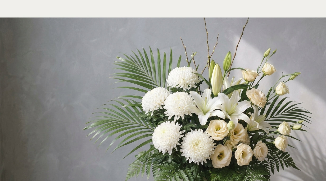 Serene white sympathy flower arrangement of chrysanthemums and lilies for condolences in Singapore