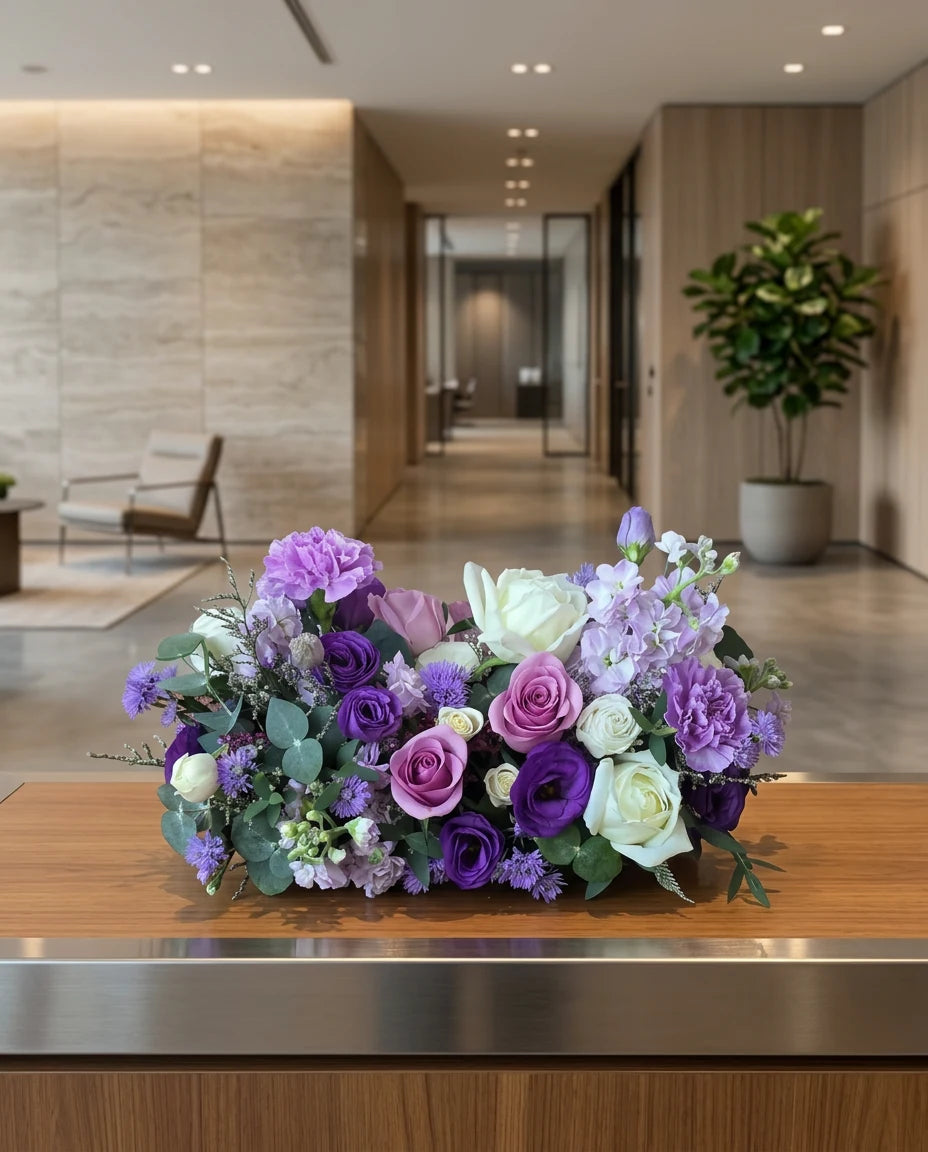 Corporate boardroom floral centerpiece arrangement on a meeting table in a modern office | Windflower Florist
