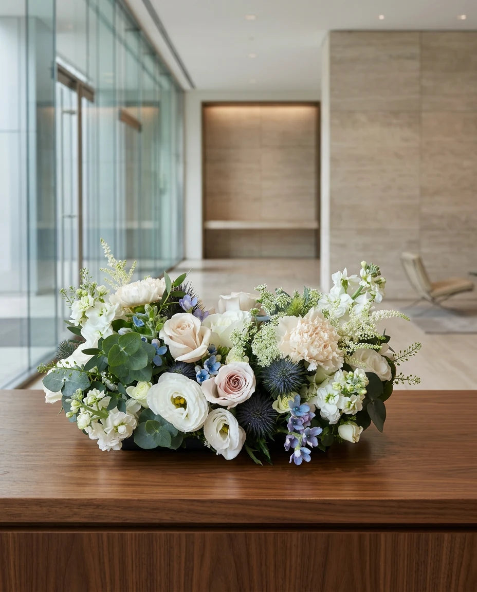 Corporate boardroom floral centerpiece arrangement on a meeting table in a modern office | Windflower Florist