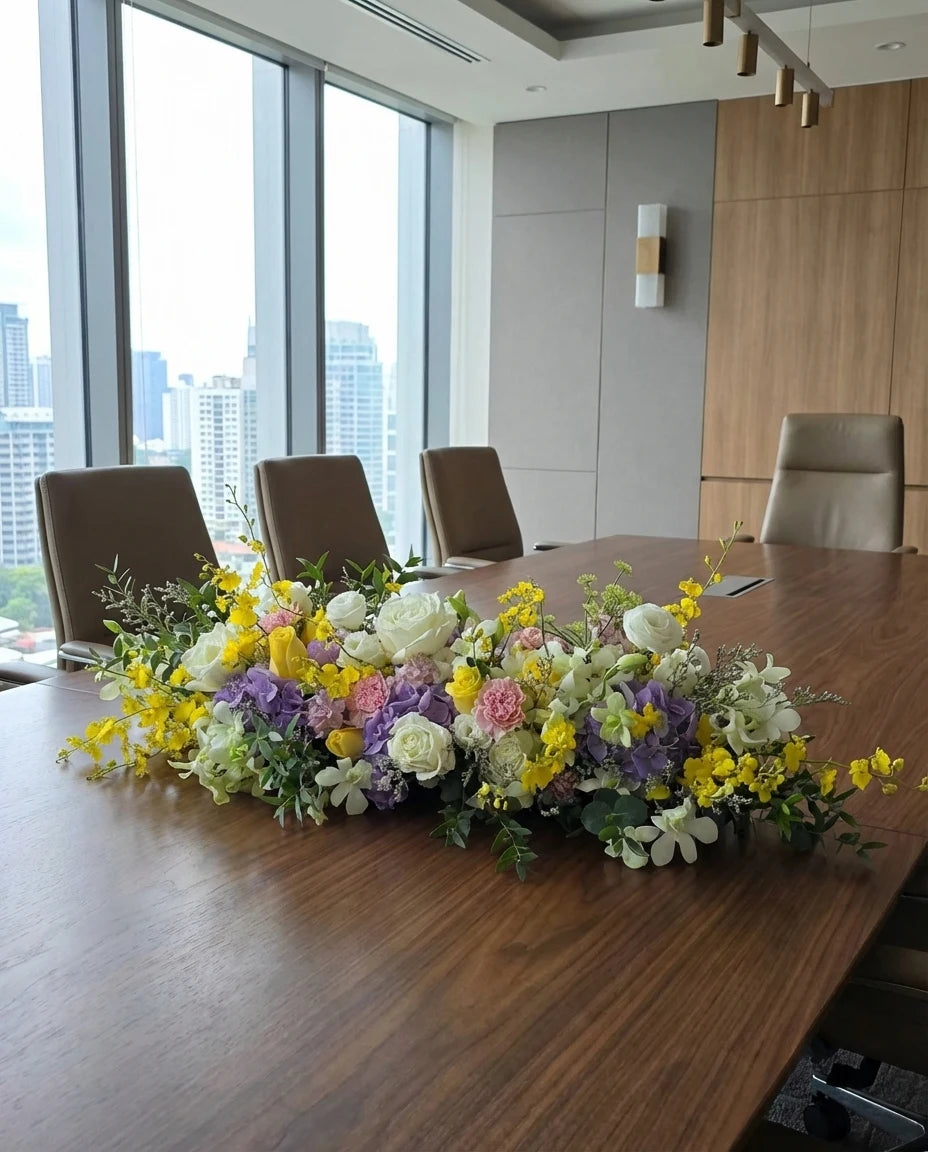 Corporate boardroom floral centerpiece arrangement on a meeting table in a modern office | Windflower Florist