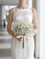 Modern bride holding the Baby's Breath Bridal Bouquet