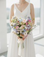 Modern bride holding the Wildflower Whimsy Bridal Bouquet