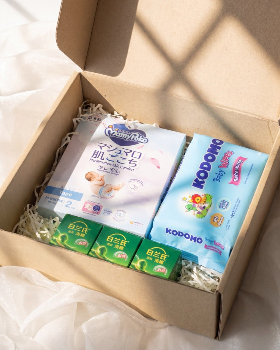Baby hamper Singapore with MamyPoko Pampers, Kodomo baby wipes and BRAND'S Essence of Chicken in a kraft gift box by Windflower Florist