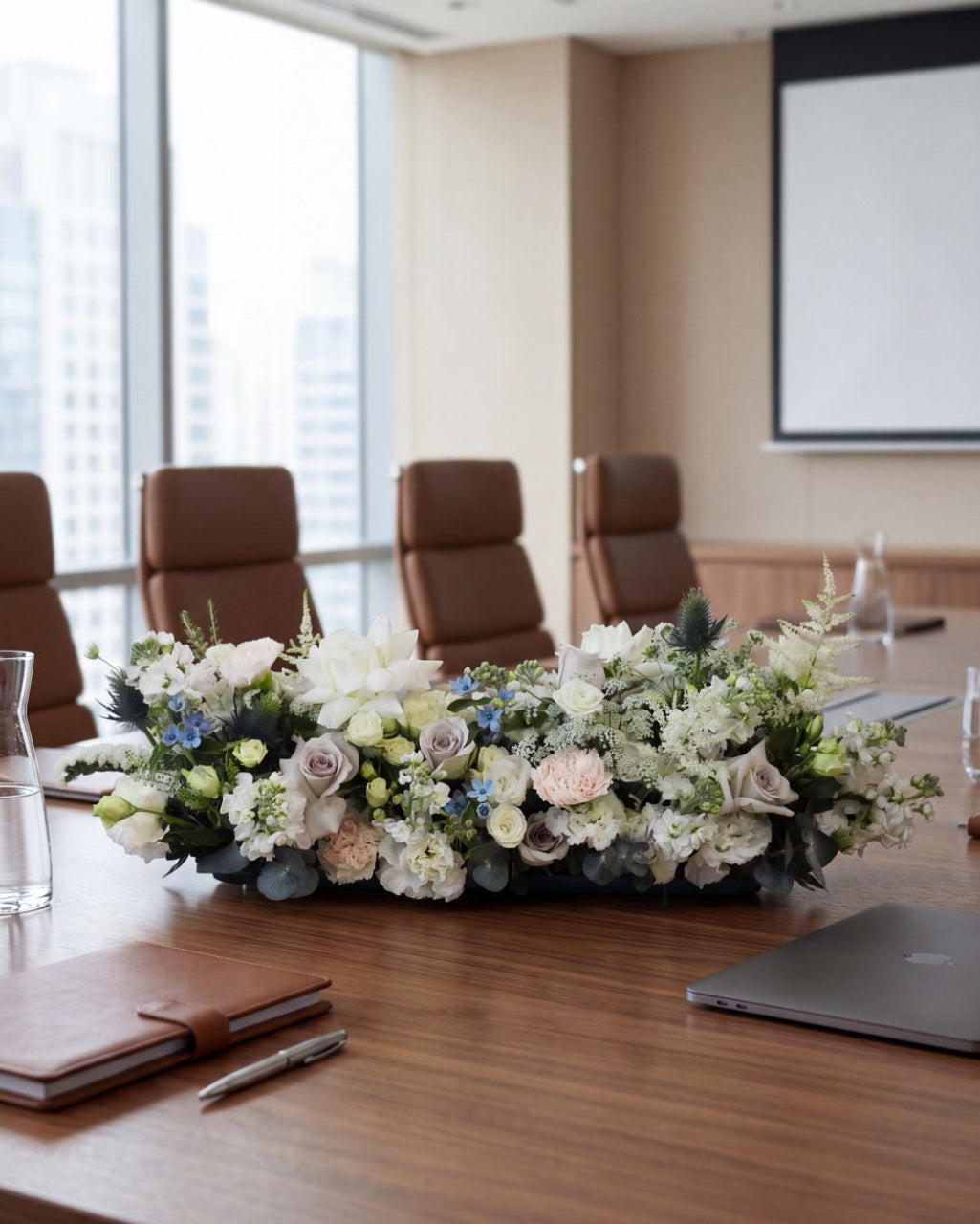 Corporate boardroom floral centerpiece arrangement on a meeting table in a modern office | Windflower Florist