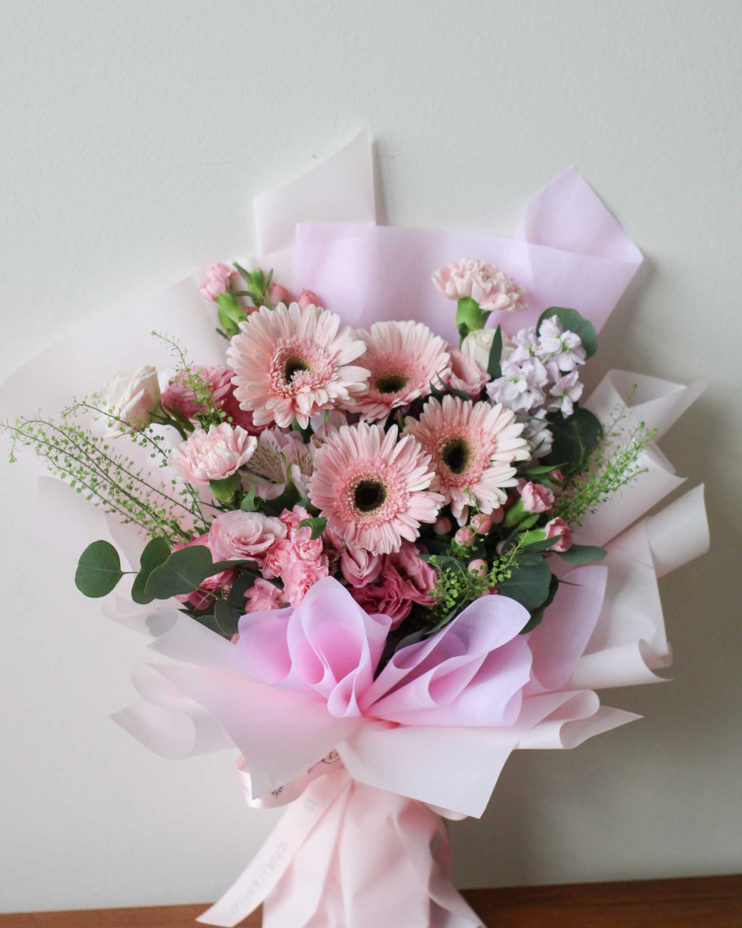 Daisy-Me-Rolling in Pink Hand Bouquet by Windflower Florist Singapore