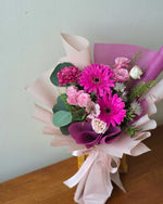 Daisy-Me-Rolling in Hot Pink Hand Bouquet by Windflower Florist Singapore