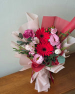 Daisy-Me-Rolling in Red Hand Bouquet by Windflower Florist Singapore