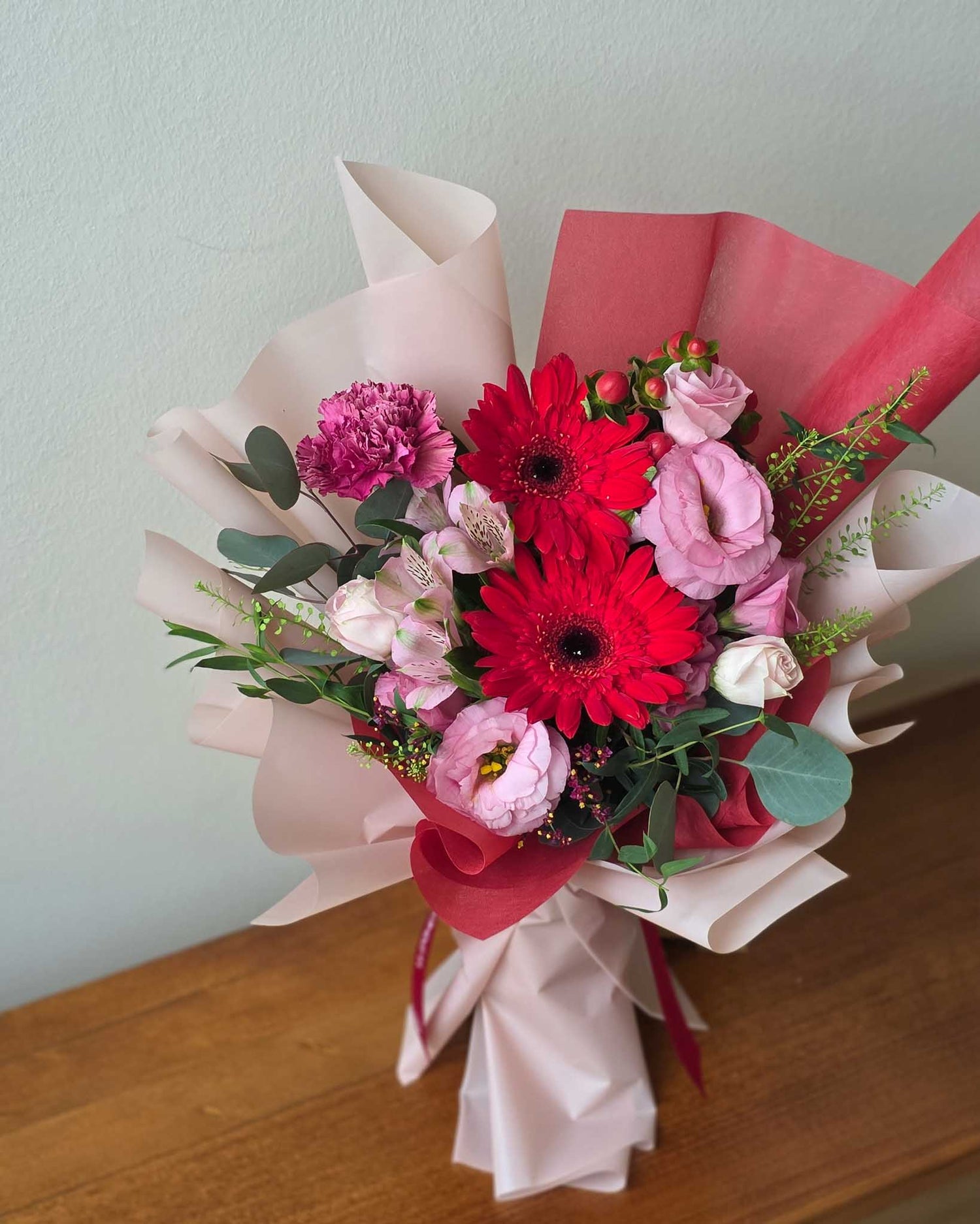 Daisy-Me-Rolling in Red Hand Bouquet by Windflower Florist Singapore