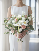 Modern bride holding the Pearl Quartz Bridal Bouquet