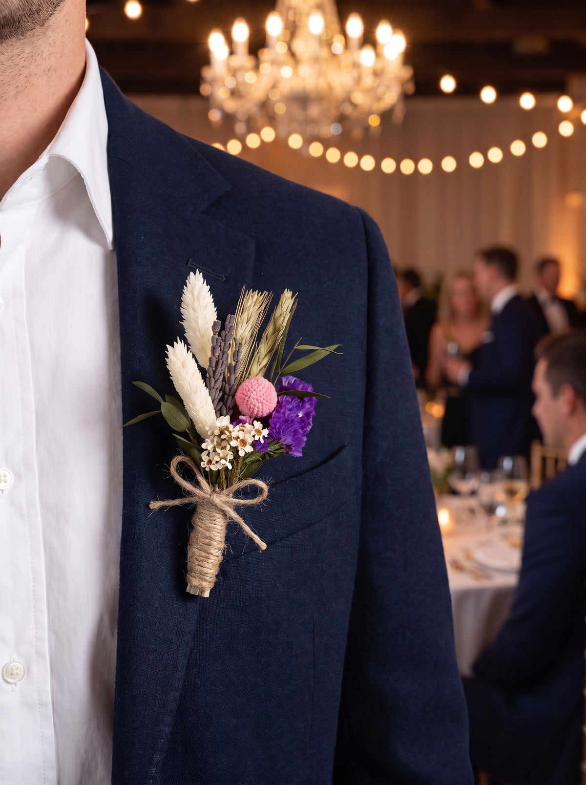 Corporate Boutonniere (Preserved & Dried, purple mix) worn on a navy blazer at a corporate gala