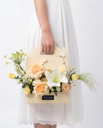 Buttercream Flower Box — White lily and peach roses in a cream butterfly carrier | Windflower Florist Singapore