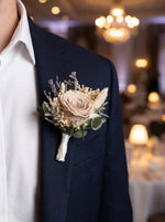Corporate Boutonniere (Preserved taupe rose) worn on a navy blazer at a corporate gala
