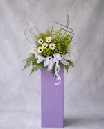 Lilac Meadow condolence flower stand, full view with cool grey backdrop