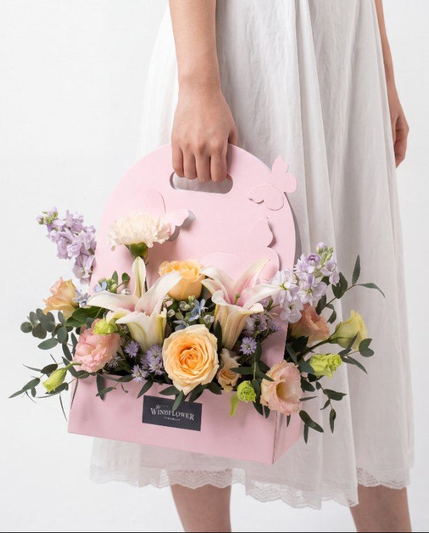 Papillon Flower Box — Blush lilies and peach roses in a pink butterfly carrier | Windflower Florist Singapore