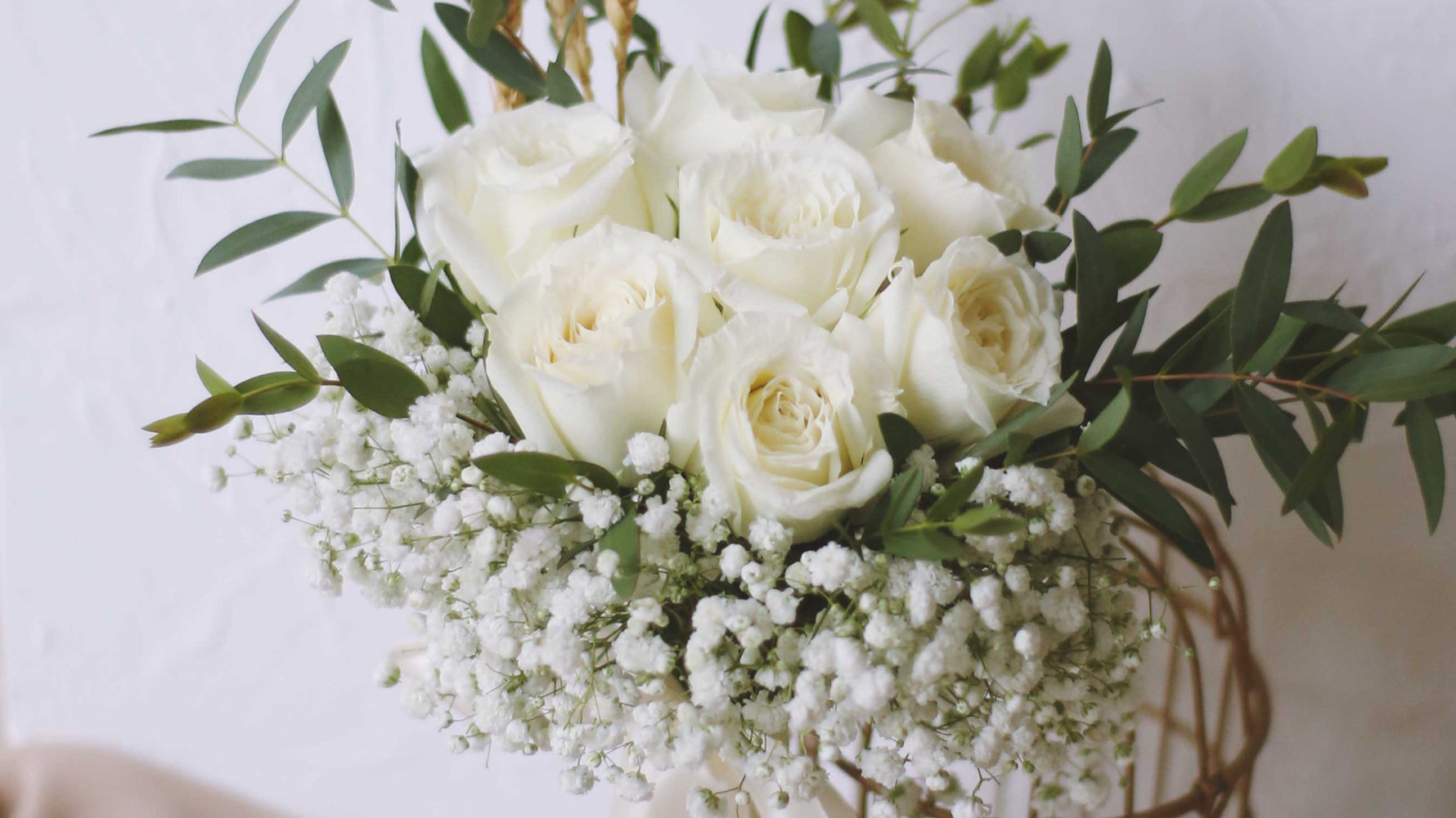 White roses bridal bouquet with babys breath
