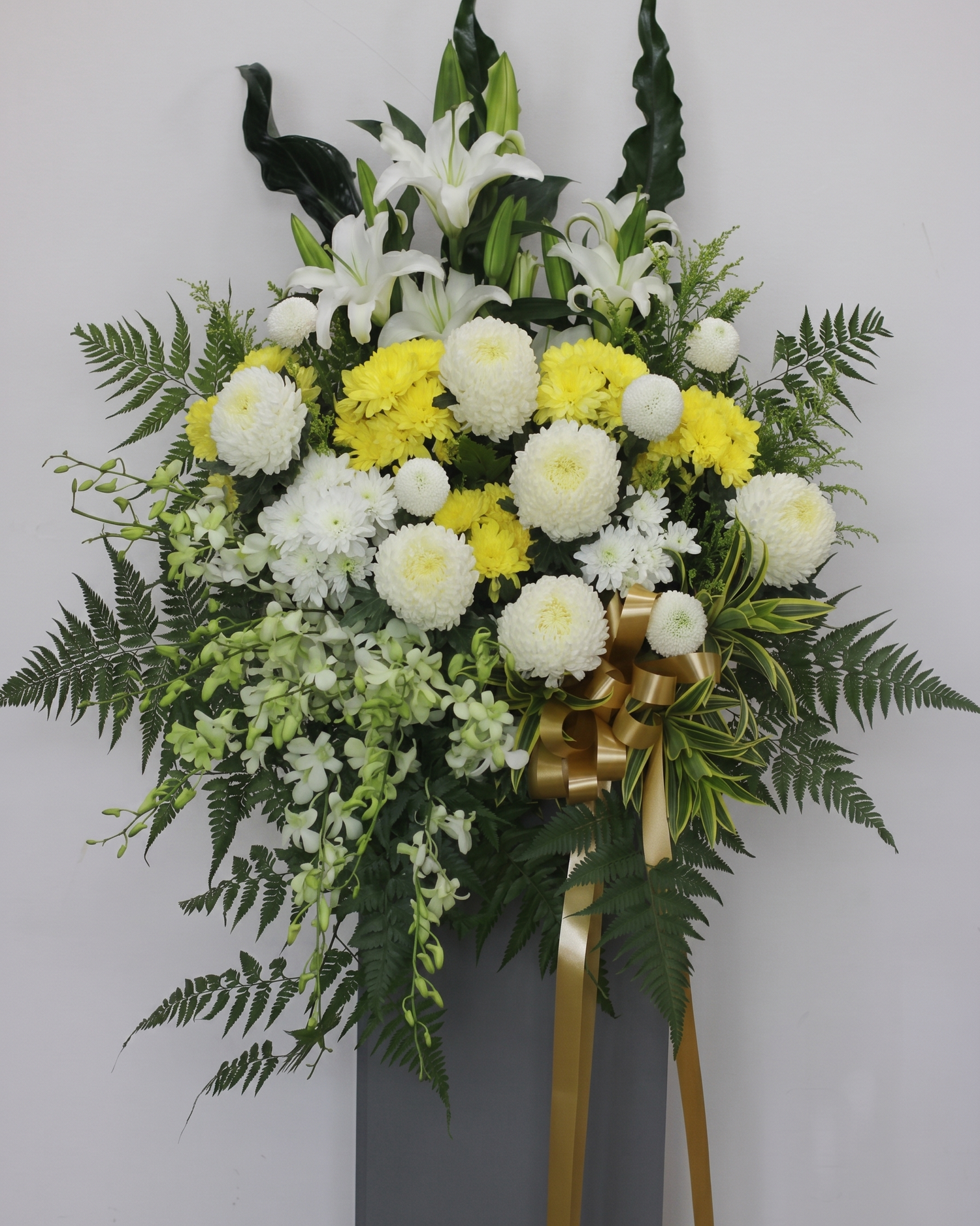 Quiet Radiance condolence flower stand, pollen removed from lily