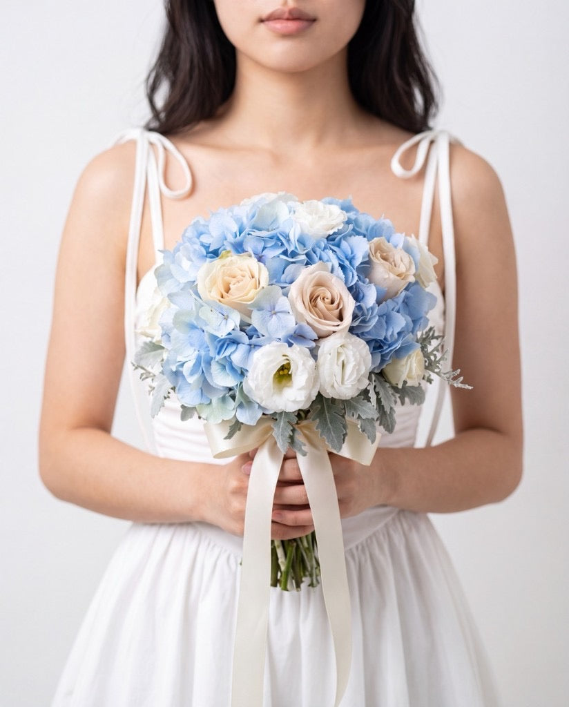 Serene Sky Hydrangea & Rose Bridal Bouquet — Light Blue Hydrangeas, Cream Roses, White Lisianthus, And Dusty Miller | Windflower Florist Singapore