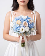 Serene Sky Hydrangea & Rose Bridal Bouquet — Light Blue Hydrangeas, Cream Roses, White Lisianthus, And Dusty Miller | Windflower Florist Singapore