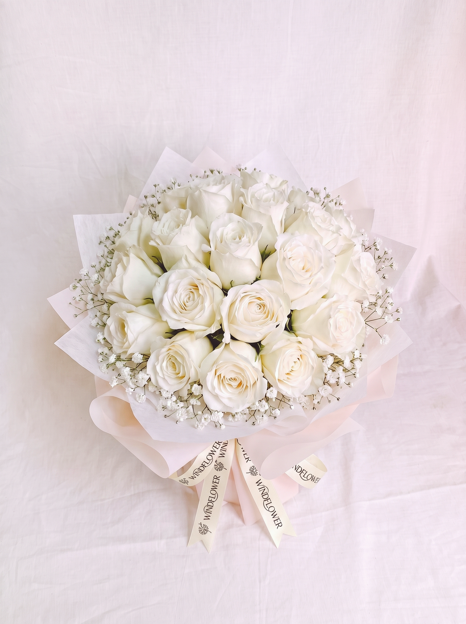 A Study in White - Rounded, with baby's breath and cream Windflower ribbon branding (natural tie)