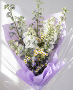 Sumire — close-up of lilac delphinium, white matthiola and chamomile