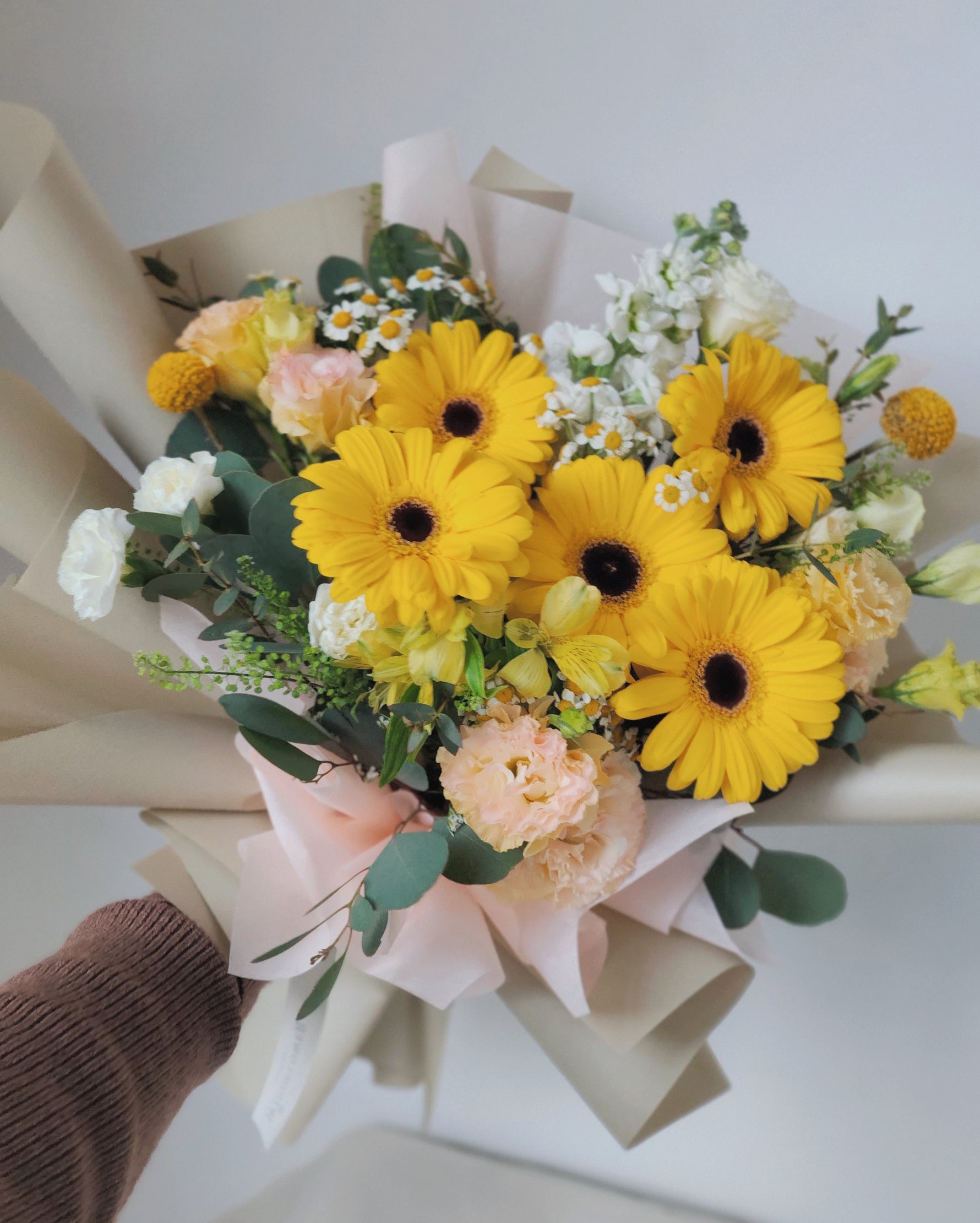Daisy-Me-Rolling in Yellow Hand Bouquet by Windflower Florist Singapore