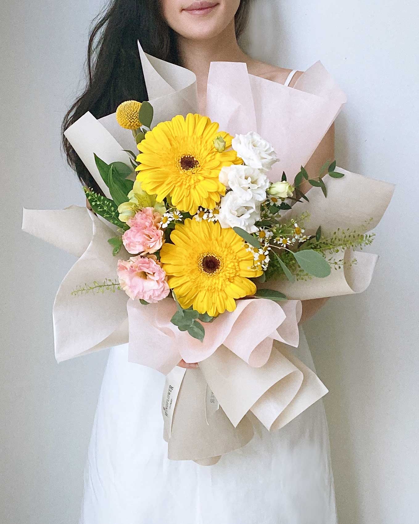 Daisy-Me-Rolling in Yellow Hand Bouquet | Free Same-Day Flower Delivery Singapore