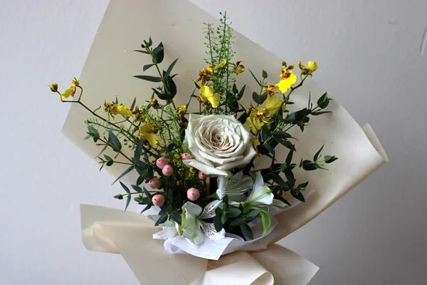 White rose and oncidium orchid bouquet from Windflower floral bar